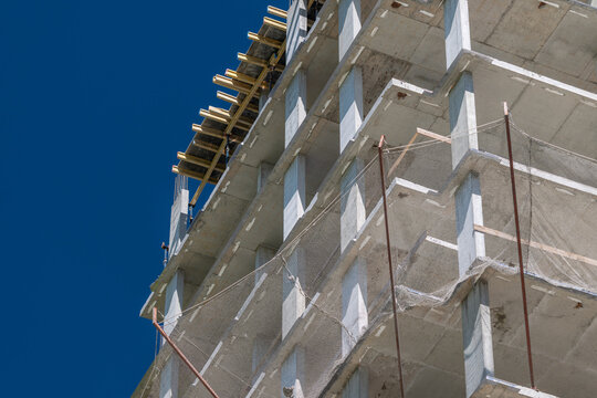 New construction rises against the clear blue sky showcasing modern architecture and diligent building practices in the heart of the city