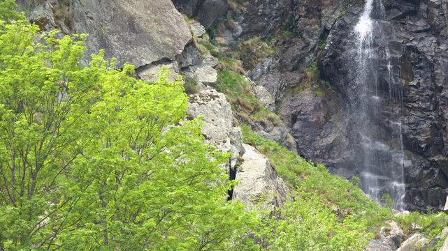 Waterfall Cascading Down Steep Rocky Cliff in Lago della Rovina
