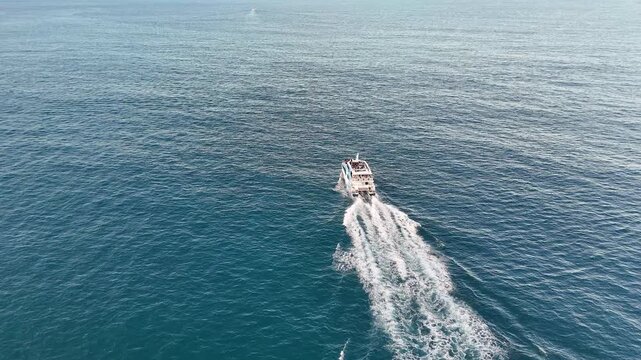 Aerial View of Ferry Boat Cruising Through Blue Ocean Water