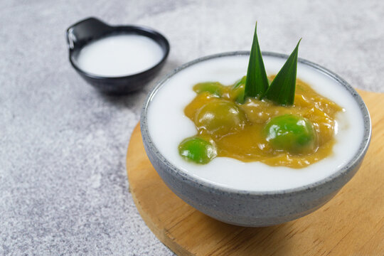 Indonesian traditional javanese sweet dessert Bubur Candil in a ceramic bowl garnished with pandan leaf
