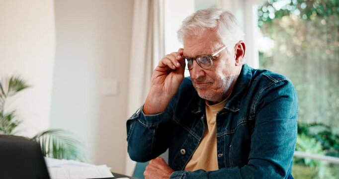 Glasses, freelancer and man with laptop in home for wealth manager, reading good news and smile. Financial advisor, happy and mature person with tech, remote work and excited in house with paperwork