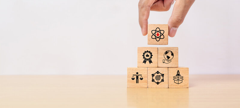 Core values, corporate values concept. Company culture and business strategy related to customer relationships and company growth. Principles guiding company actions. Core values icon on wooden blocks