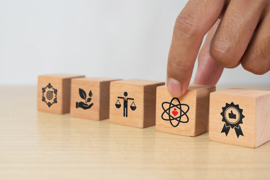 Core values, corporate values concept. Company culture and strategy related to business, customers, people, and company growth. Principles guiding company actions. Core values icon on flat wooden cube