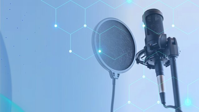 Professional condenser microphone with a pop filter in a studio