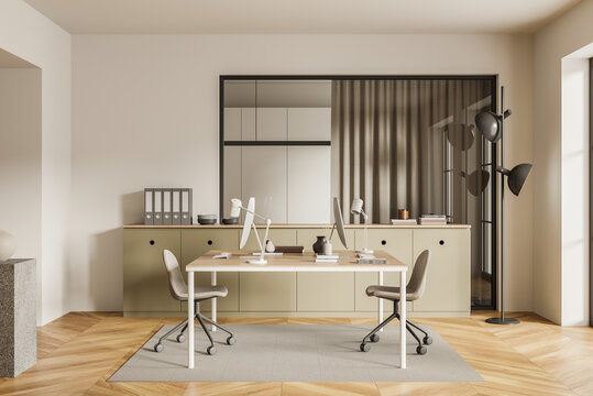 Modern minimalist office with twin desks, chairs, cabinets, glass partition and lamps in warm neutral interior, 3D Rendering, workspace concept