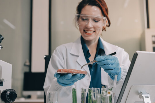 Scientists in lab coats work with plants in a modern lab, focusing on research and experimentation under bright, sterile conditions.