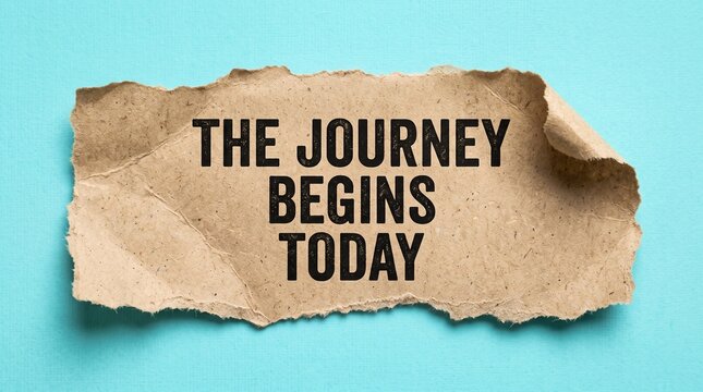 Encouraging journey begins today sign on brown paper