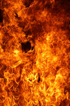 Fire surrounds isolated flame. Fire follows blazing flame. Creative fire for overlay. Burning fire on black.