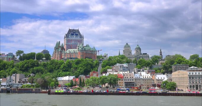 Sailboat on Saint Lawrence River with Chateau Frontenac skyline in wide eye level view in Quebec City, Quebec, Canada. 