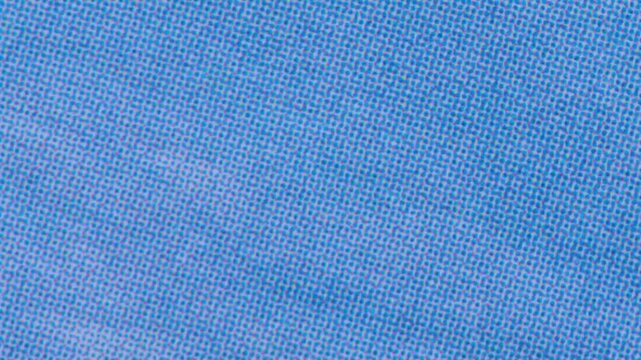 Close up of blue fabric texture with a repeating dot pattern high quality textile background showing a woven material surface with a uniform geometric design