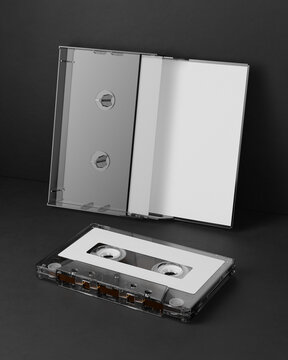 3d render. A mock-up of an audio cassette with a box on a black background. Retro aesthetics, clean composition, ideal for design and media projects.