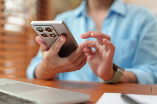 Woman using a smartphone to browse apps, social media, and online content, highlighting mobile communication, digital connectivity, and modern technology in everyday life.