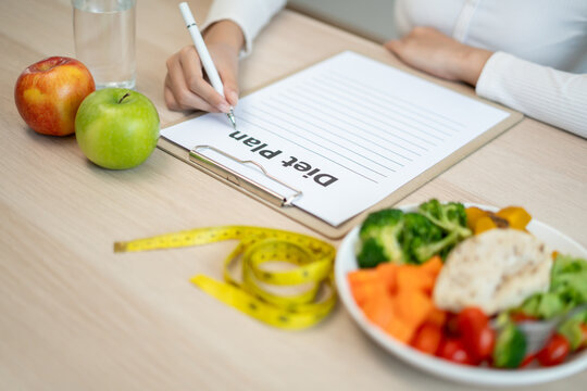 Diet and dieting. diet plan and check calories for healthy food. weight loss, lose, balance, control, reduce fat, low calories, routines, exercise, body shape, healthy foods.