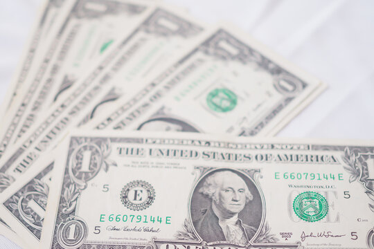USD currency , Many dollar bank notes Placed on the table.The  Dollar is the currency of USA that is used to change, buy, sell, accumulate, and invest in united kingdom's state people.