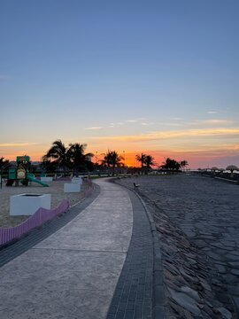 Sunrise at the Waterfront Promenade with Palm Trees in Duba, Saudi Arabia