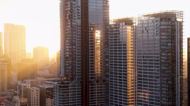 A slow orbit side to side shows the devastation, up close, of the Abandoned Los Angeles Skyscraper project. This drone shot reveals the vandalized structure and the Graffiti that covers it.