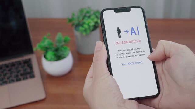 User holds a smartphone showing an AI alert that their skills may no longer meet the demands of an AI-powered workplace.