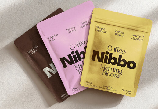 Coffee Bag Mockup PSD With Three Colorful Packs On A Soft Textured Surface