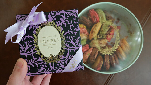 Close up paper box of Laduree- fine French macarons and artisanal pastries store from Paris, France