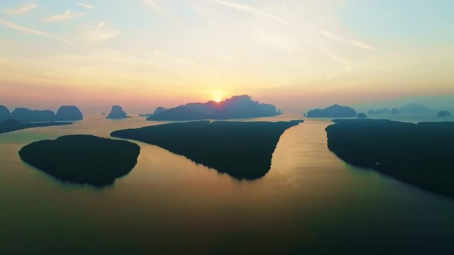 Colorful sunset or sunrise above the sea surface,Aerial view drone fly over open sea,Reflected sun beautiful light of nature on water surface,Sunset over ocean,Sea summer and travel vacation concept