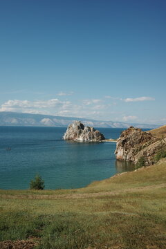 Shamanka Rock against the backdrop of Lake Baikal