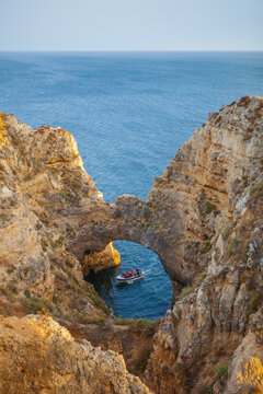 boat aproaching to Rock formations of Ponta da Piedade, Lagos