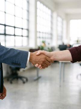 Close up of a man and woman shaking hands