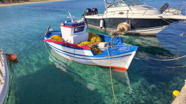 Charming fishing boat anchored in Agios Arsenios waters, Naxos, Greece