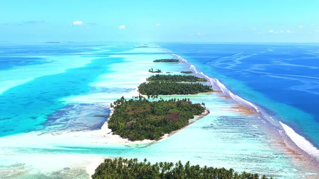Tropical atoll with turquoise water and green Pacific islands