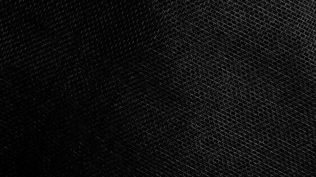 Black plastic mesh texture background. Dark abstract synthetic grid pattern. Rotation