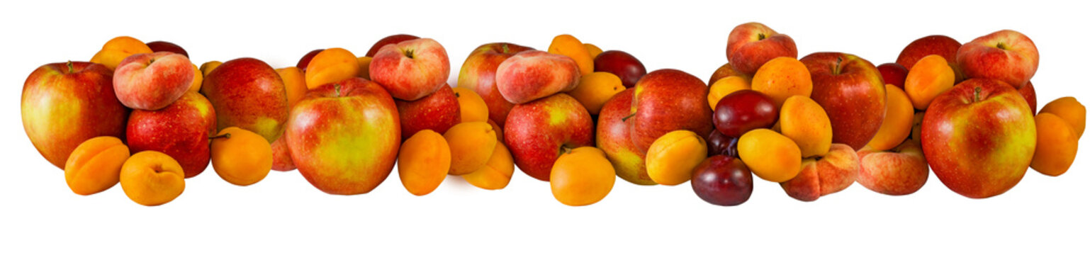 Fruit arrangement on a table featuring apples, peaches, and plums in various positions