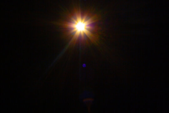 Sun flare on the black background