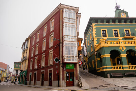 Tineo, Asturias, Spain - May 16, 2025: Historic triangular building of Farmacia Lomba next to the green Town Hall plaza in Tineo on the Camino Primitivo.