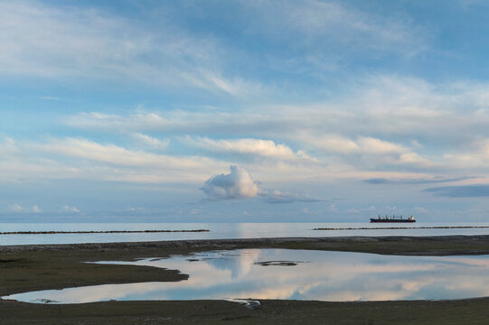 Tropical Mediteranean beach cloudy deep blue sky 
