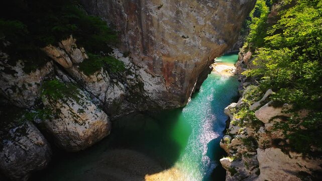 Sentiero del Dint view of emerald mountain water flowing through the narrow Cellina gorge, Friuli, Italy.