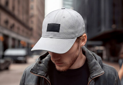 Man in the street wearing a blank cap with embroidered patch Mockup. Generative ai