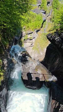 Reichenbach Falls In Switzerland During Spring Season Featuring Powerful Waterfalls, Mountain Scenery, Forest Views, Stunning Alpine Landscape. Natural Beauty, Fresh Green Nature, Famous Destination