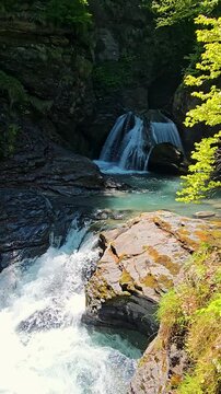 Reichenbach Falls In Switzerland During Spring Season Featuring Powerful Waterfalls, Mountain Scenery, Forest Views, Stunning Alpine Landscape. Natural Beauty, Fresh Green Nature, Famous Destination