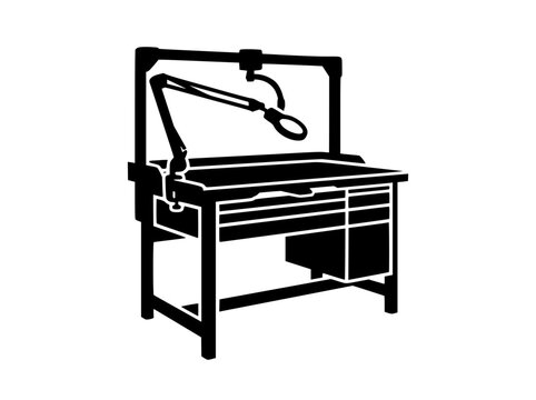 Silhouette of a jeweler's workbench with adjustable lamp and drawers