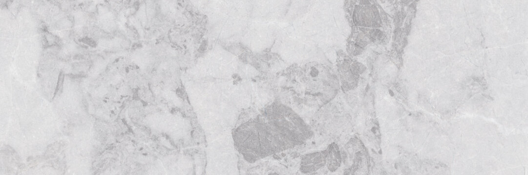 White and light gray marble texture with soft natural veining. Elegant surface for ceramic tiles, flooring, and interior design.
