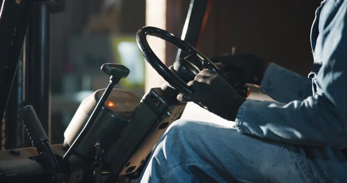 Forklift, hands and logistics with man in warehouse for manufacturing, cargo or shipping. Delivery, stock transport and workshop with person in factory as driver for distribution and supply chain