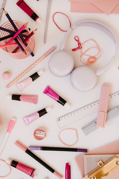 Top View Pink Stationery And Art Tools Setup On White Table