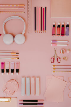 Symmetric Flat Lay Border Of Pink School Supplies And Art Tools Arranged Around Empty Central Copy Space