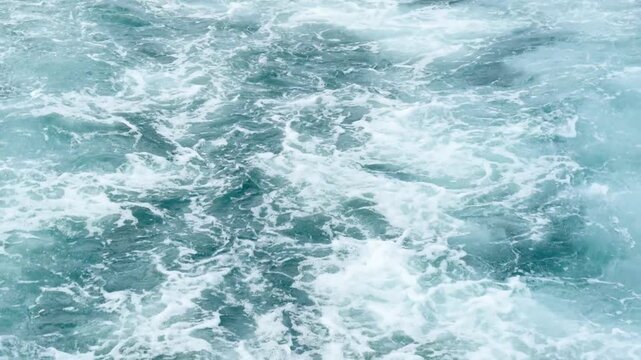 Moving yacht at the ocean with water splashes. Ocean sea water wave reflections. Motor boat in the sea