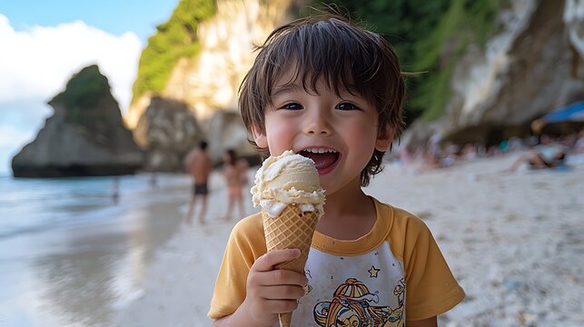 Happy toddler enjoys ice cream on tropical beach