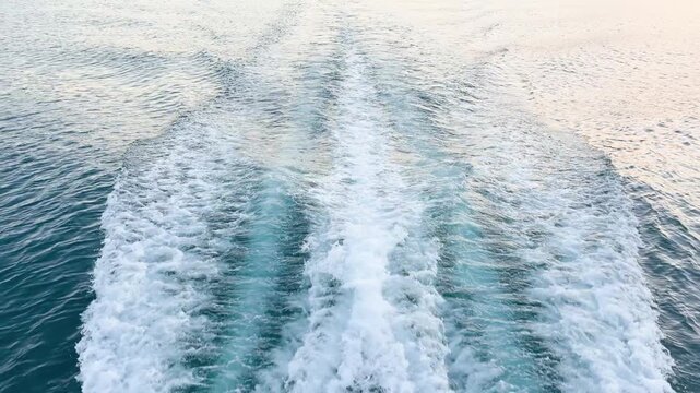Moving yacht at the ocean with water splashes. Ocean sea water wave reflections. Motor boat in the sea