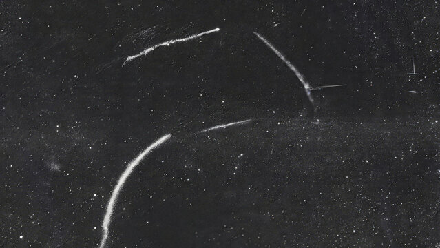 Curved White Emulsion Scratches on Gray Vintage Film Texture