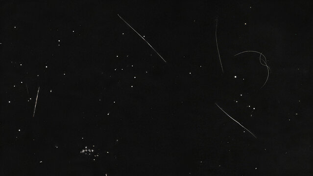 Sparse Hairline Film Scratches and Dust on Black Background