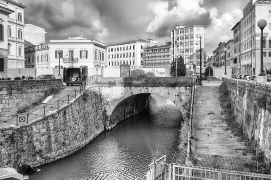 Canals and boats with historic buildings in Livorno, Italy