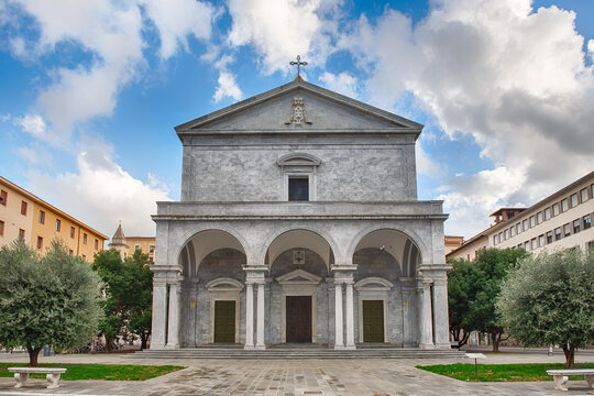 Grand facade of Livorno Cathedral with arches and columns, Italy